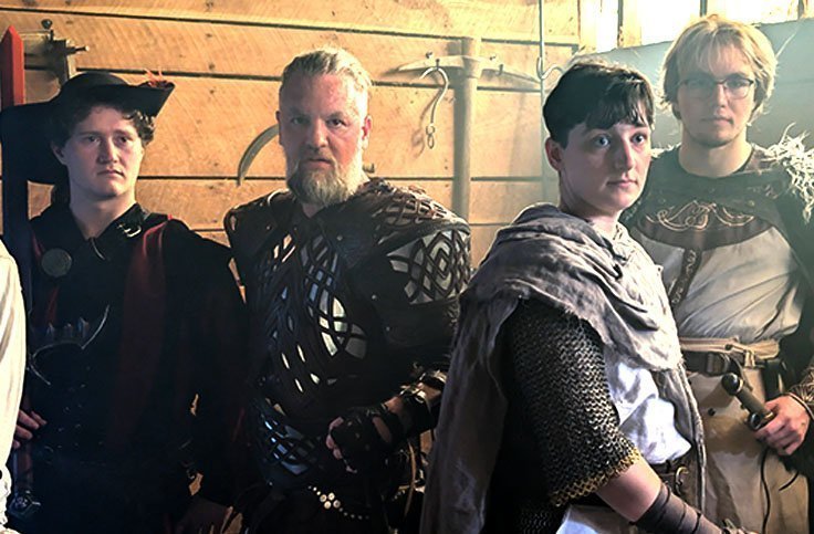 Four adults in medieval fantasy costumes